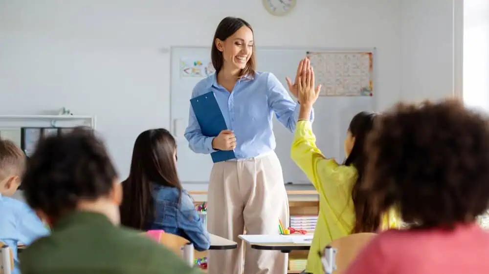 Engaged teacher interacting with students in a virtual classroom setting.