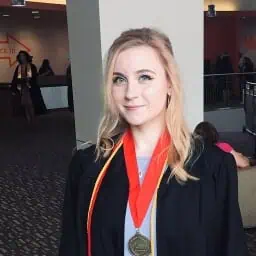 Young woman graduate with medal at Proximity Learning event.