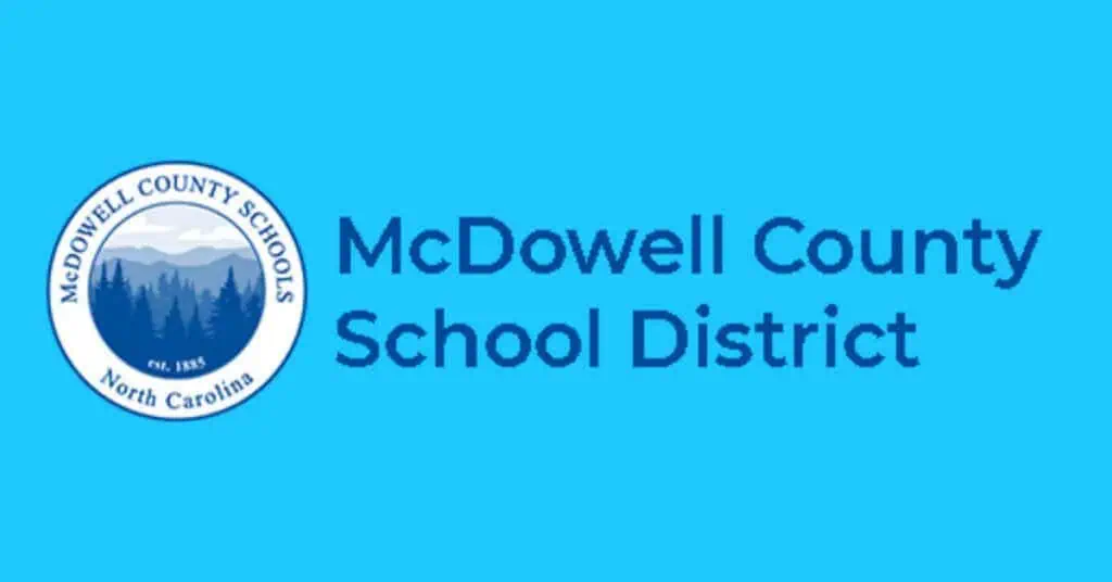 Blue McDowell County School District logo pictures a blue forest and mountains.