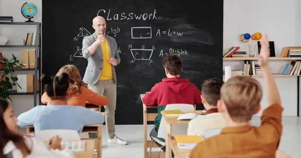 Virtual classroom with teacher and students engaging in online learning.