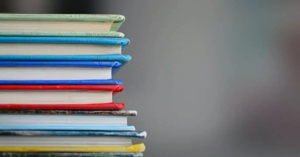 Stack of colorful books representing online learning and education resources.