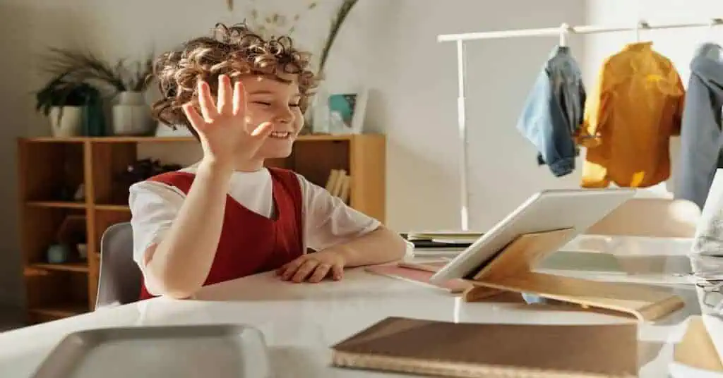 Child engaging in online learning with a tablet at home.