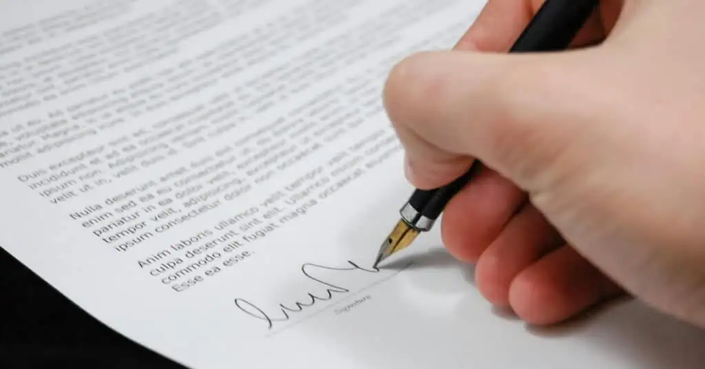 teacher signing a letter of intent