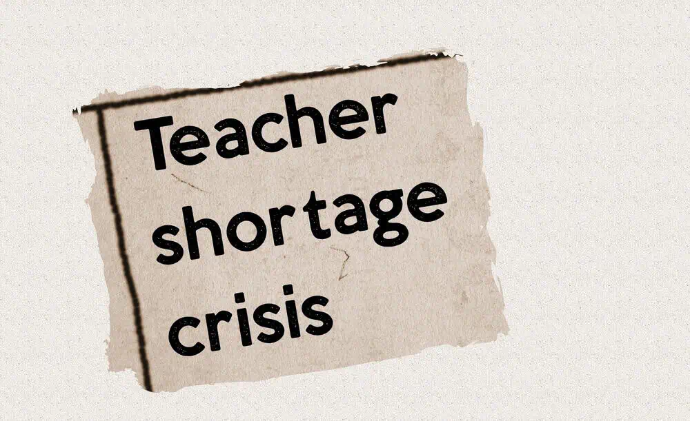 Teacher shortage crisis sign highlighting the education staffing issue.