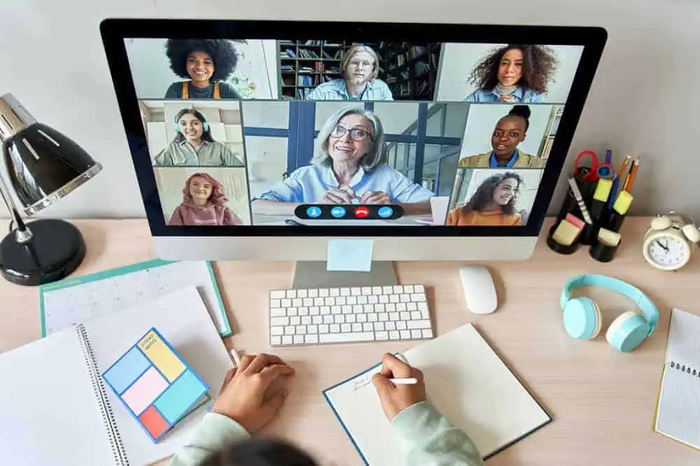 Virtual classroom with diverse students and teacher on a video call.