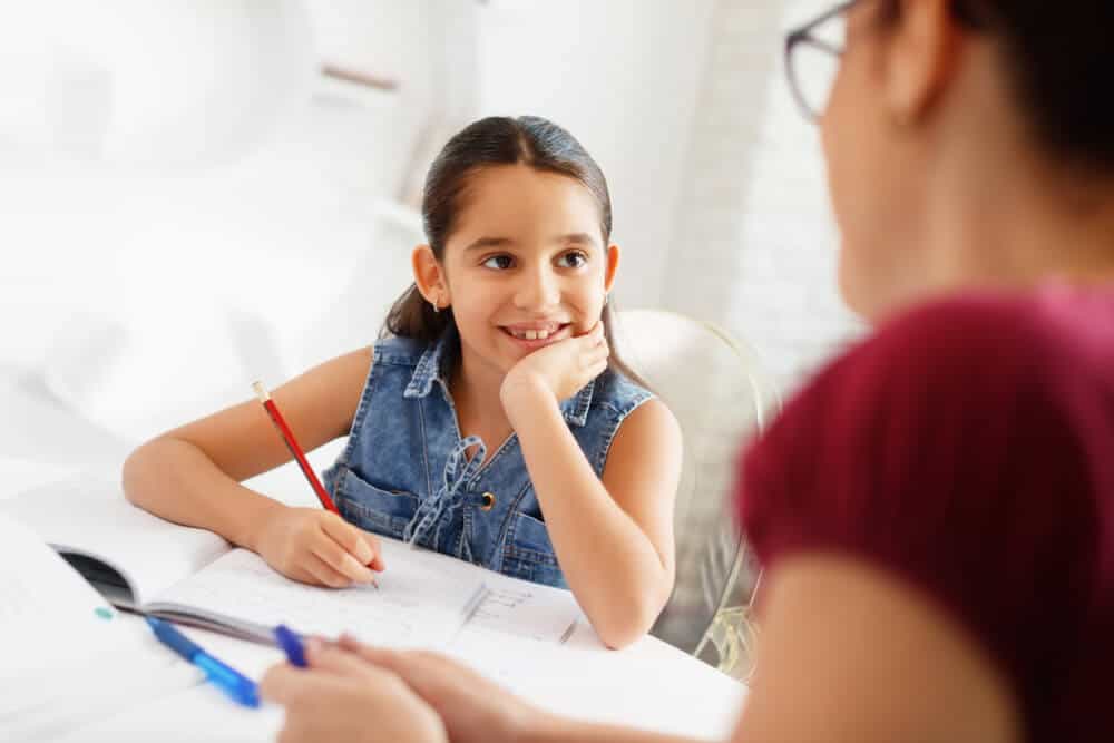public school student with homework tutor