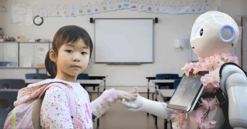Young student holding hands with a humanoid robot decorated with flowers in a classroom