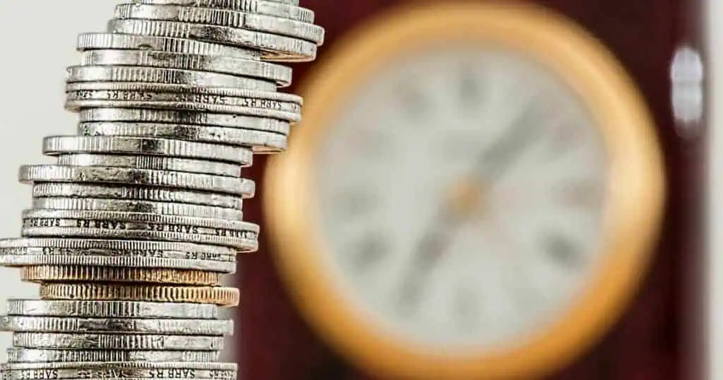 A stack of coins is on the left side of the image