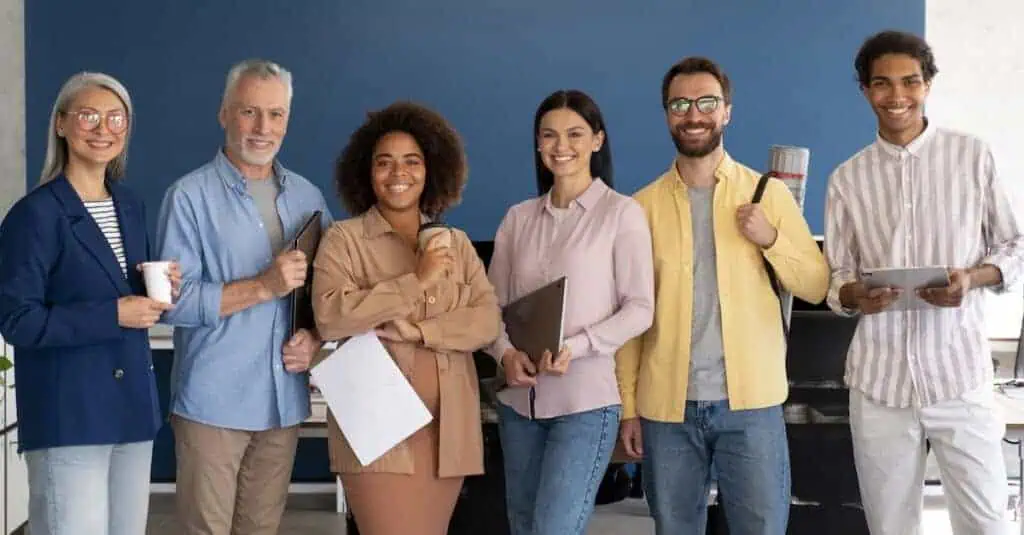 A group of certified teachers stands in a line