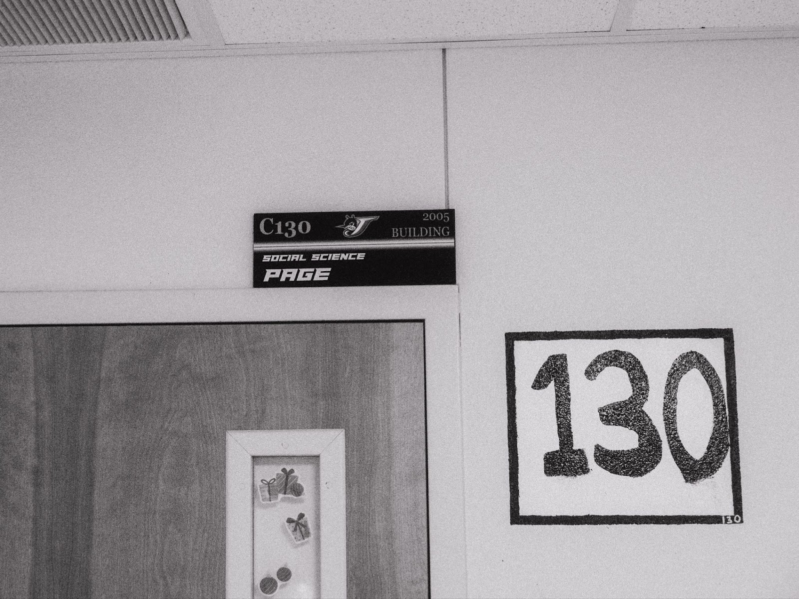 close up of a plaque and classroom number 130
